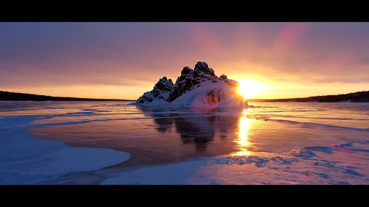 Golden Sunset Over a Frozen Lake with a Snow-Covered Island