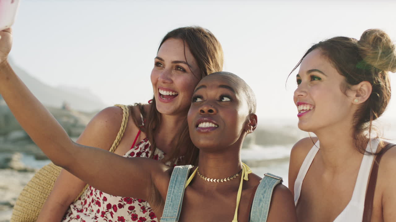 Women friends, beach selfie