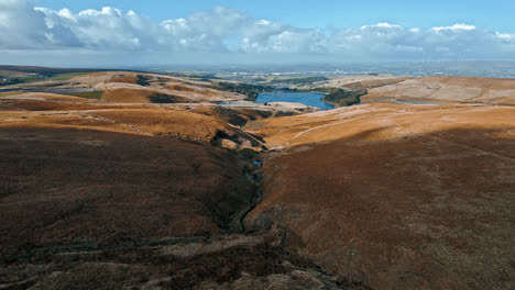 Aerial-drone,-cinematic-footage-of-a-valley-with-3-lakes-reservoirs,-piethorn,-kittcliffe-and-ogden-reservoir,-Oldham,-UK