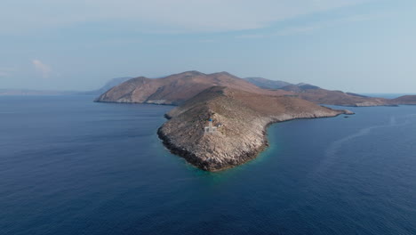 cape tainaron lighthouse at the end of mani peninsula surrounded by mediterranean sea, peloponnese, panoramic view, drone