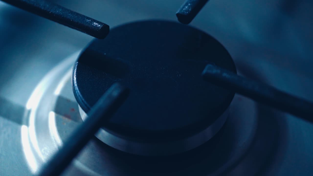 Gas burner on the gas stove. Natural gas burning on kitchen gas stove