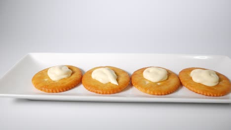 round crackers with mayonnaise