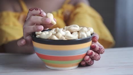 child eating cashews