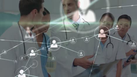 Animation-of-network-of-connections-with-icons-over-diverse-doctors