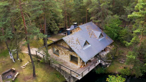 Cozy-summerhouse-in-a-deep-forest,-by-a-small-forest-lake,-Czechia