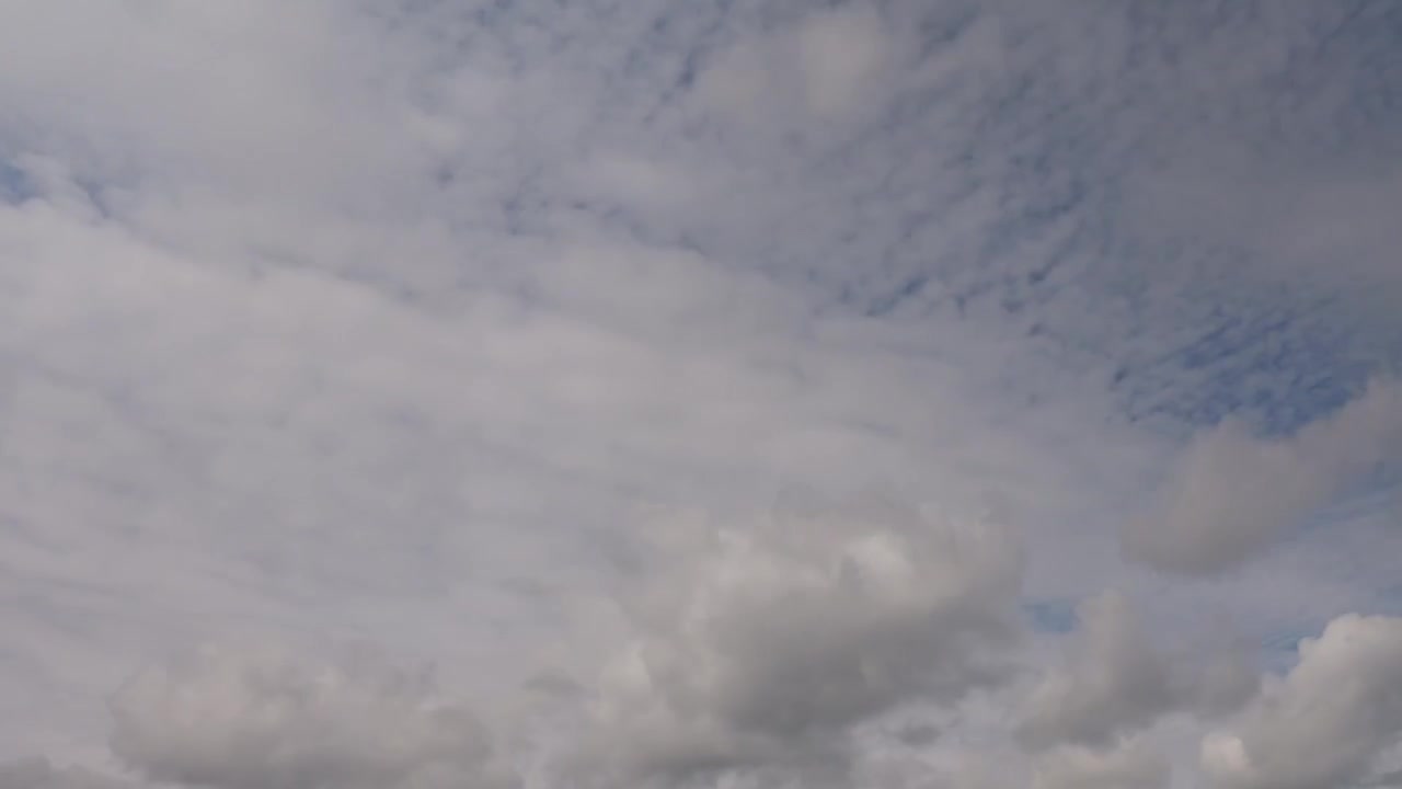 Grey Cloud Layers Timelapse Moving in Opposite Directions