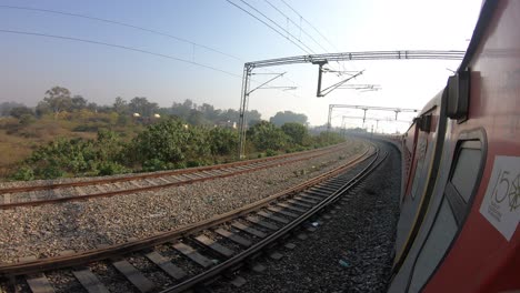 train window leaning out point of view during long distance train ride travel, indian railways