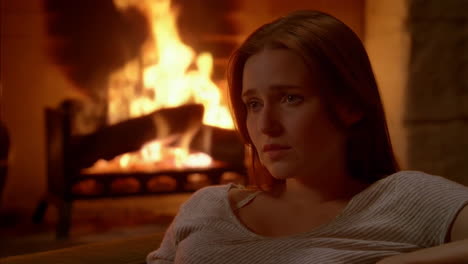 woman by the fireplace