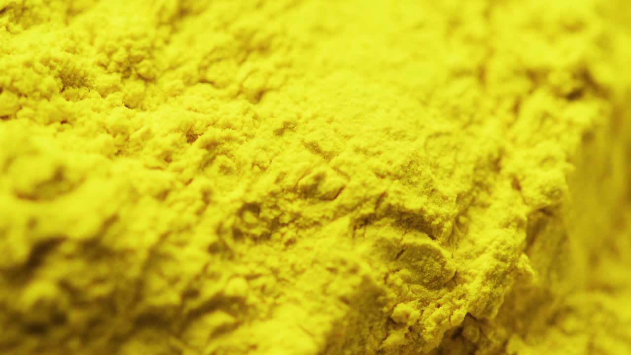 Video of close up of yellow powder with copy space