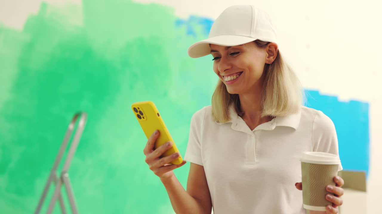 Woman using phone during home renovation