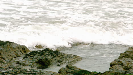 waves rolling in over the rocks