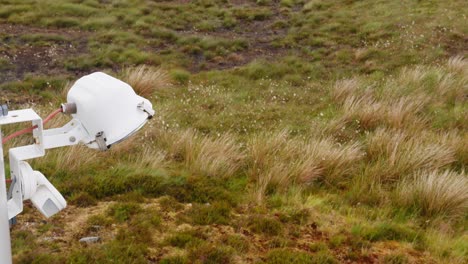 shot of a spotlight attached to a wind turbine on the moor and peatland