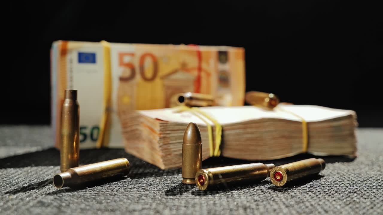 Bullets and Cash on Dark Cloth – Europe War Profiteering Concept Still Frame
