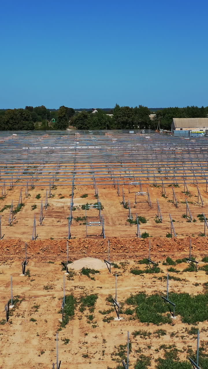 Solar photovoltaic cell panel frame. High angle view of frame for solar panels on energy farm Vertical video