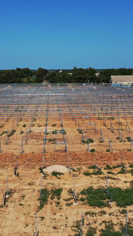 solar photovoltaic cell panel frame. high angle view of frame for solar panels on energy farm vertical video