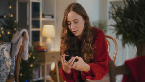 Sad-woman-with-smart-phone-at-home