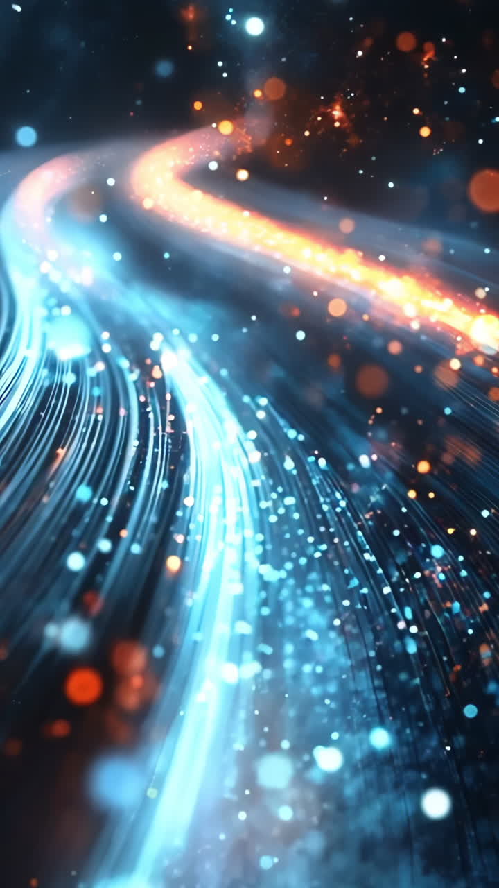 A bright blue and orange line of light with many small dots. The line of light is moving and he is a part of a larger image