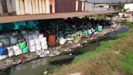 illegal waste water disposal contaminated ground water with harmful chemicals hazardous waste toxic materials recycling processing facility of electronic e-waste