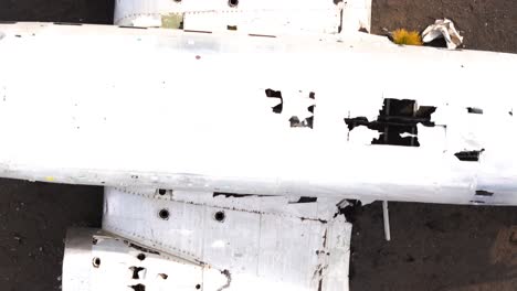 top-down shot overhead the sólheimasandur dc3 plane crash on a beach in iceland