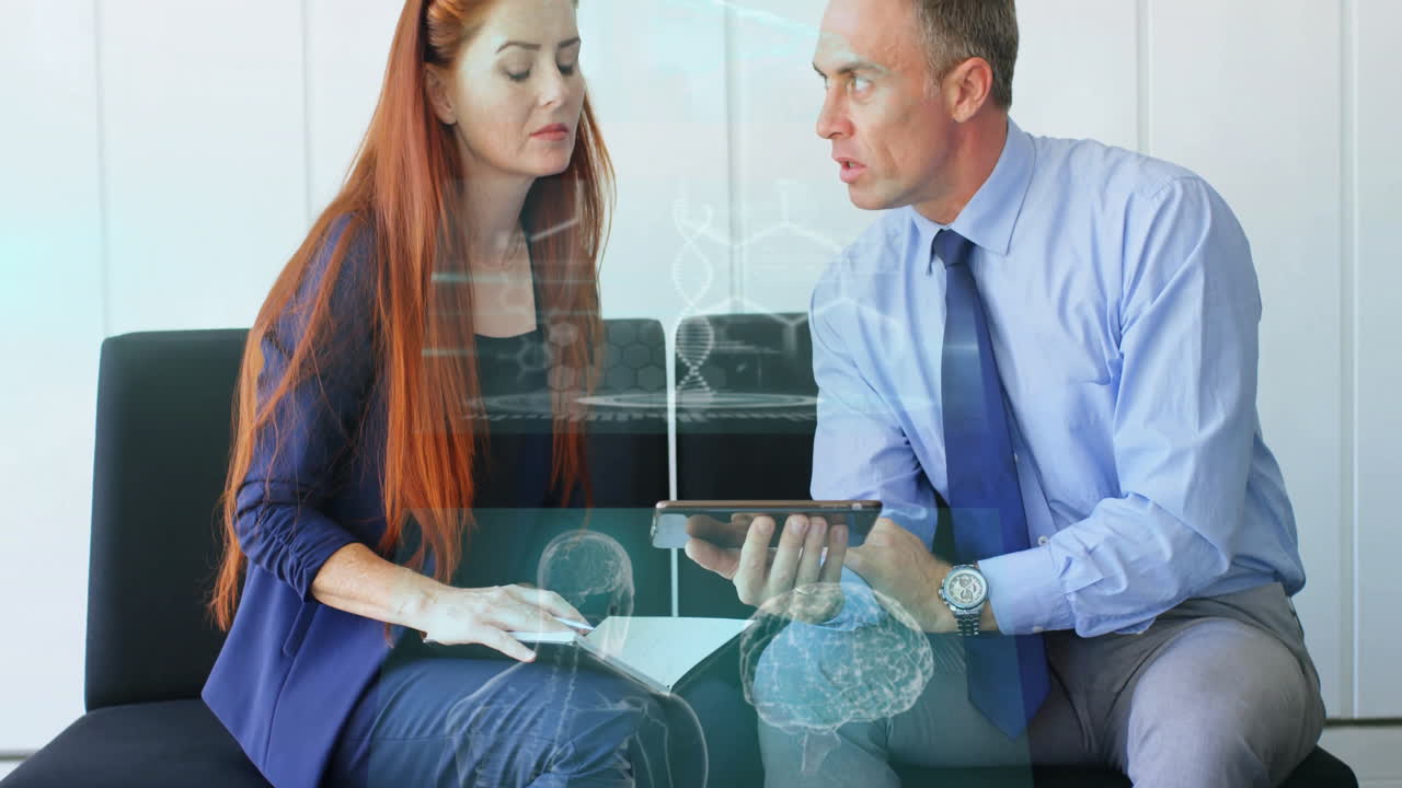 Business team leaning on bench reviewing notebook and tablet, showing animated data charts