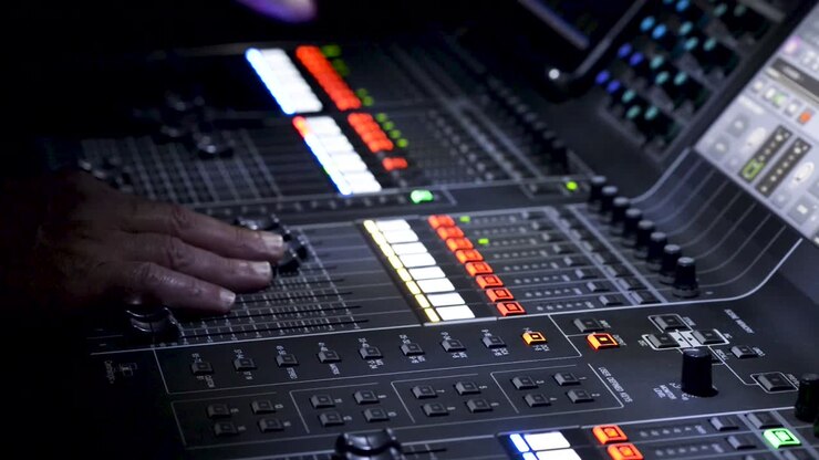 Person operating sound editing table, panoramic view
