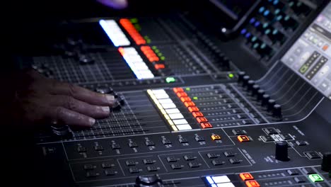 person operating sound editing table, panoramic view