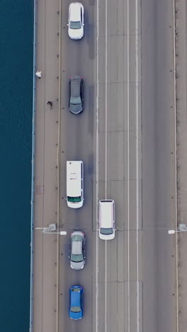 traffic jam. car traffic with pedestrians on the bridge over the river. view from the top. aerial view