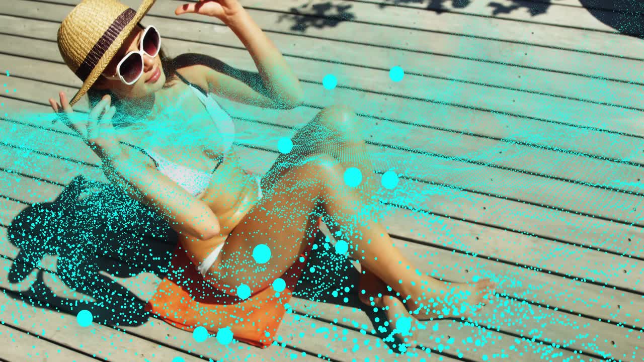 Woman arriving for leisure lying on orange towel on deck adjusting hat brim particles flickering