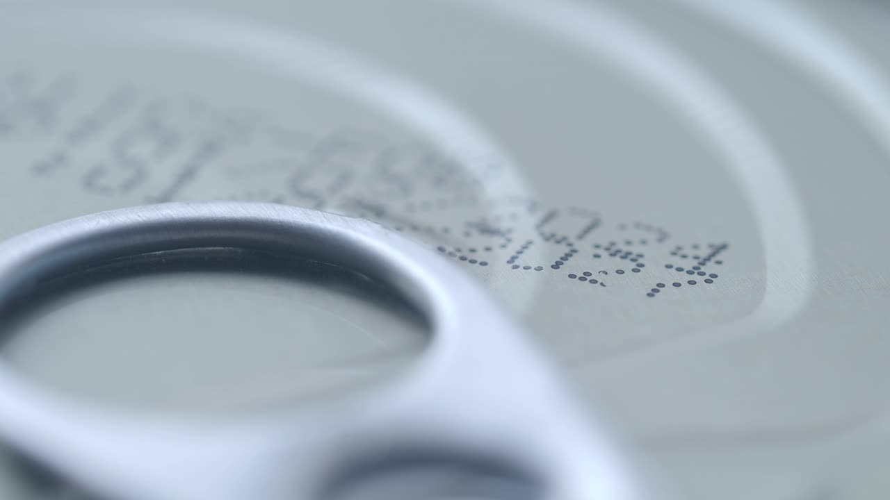 Close-up of a can lid with a pull-tab