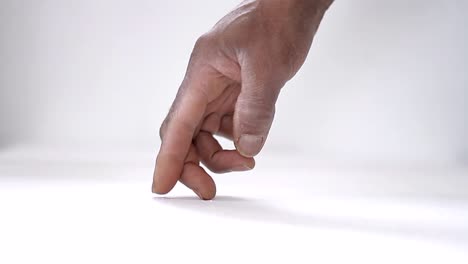 walking-fingers-on-table-with-white-background-stock-footage