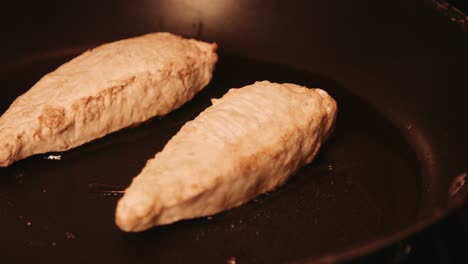 elegant shot of vegan plantbased chicken fillet being cooked