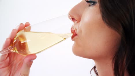 close-up of smiling woman drinking a glass of champagne 4k