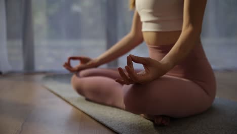 a woman practices mindfulness in a calming serene setting a peaceful scene of a woman practicing mindfulness in lotus position on a yoga mat with natural light enhancing the calming atmosphere