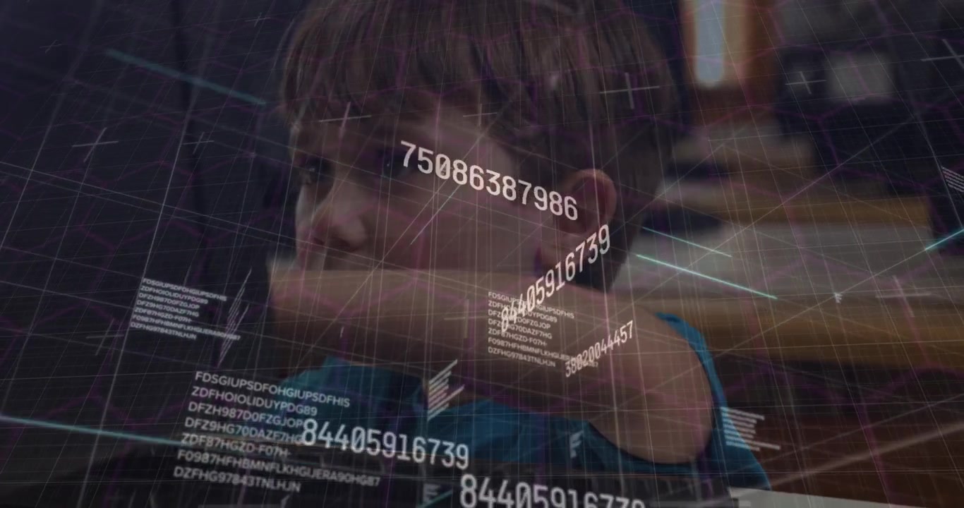 Young Boy Using Computer with Digital Data Overlay