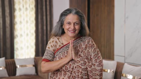 Aged-Indian-woman-in-saree-doing-Namaste