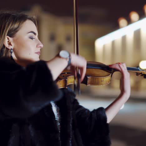 playing violin instrument in the winter time