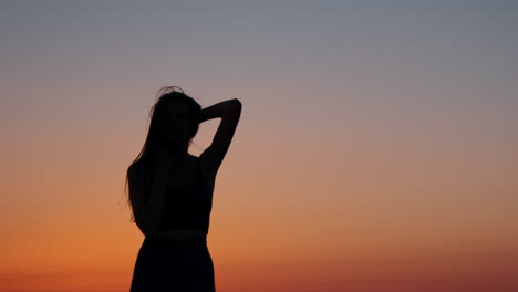 woman silhouette at sunset