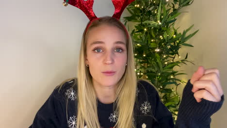 Young-Woman-On-Christmas-Video-Call-Attempting-to-Guess-Word-During-Charades-Game