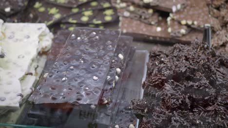 a selection of delicious chocolate bars on display in a shop.