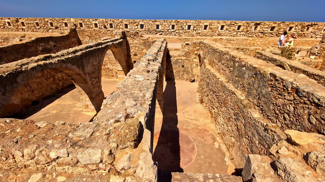 The ancient, stone walls and archways of the Venetian Fortezza Castle at Rethymno, Crete, Greece