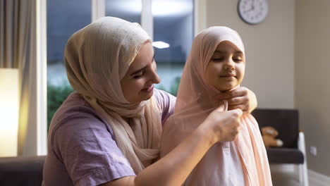 close-up view of mother and daughter at home.