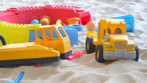 colorful plastic toys in a sandbox