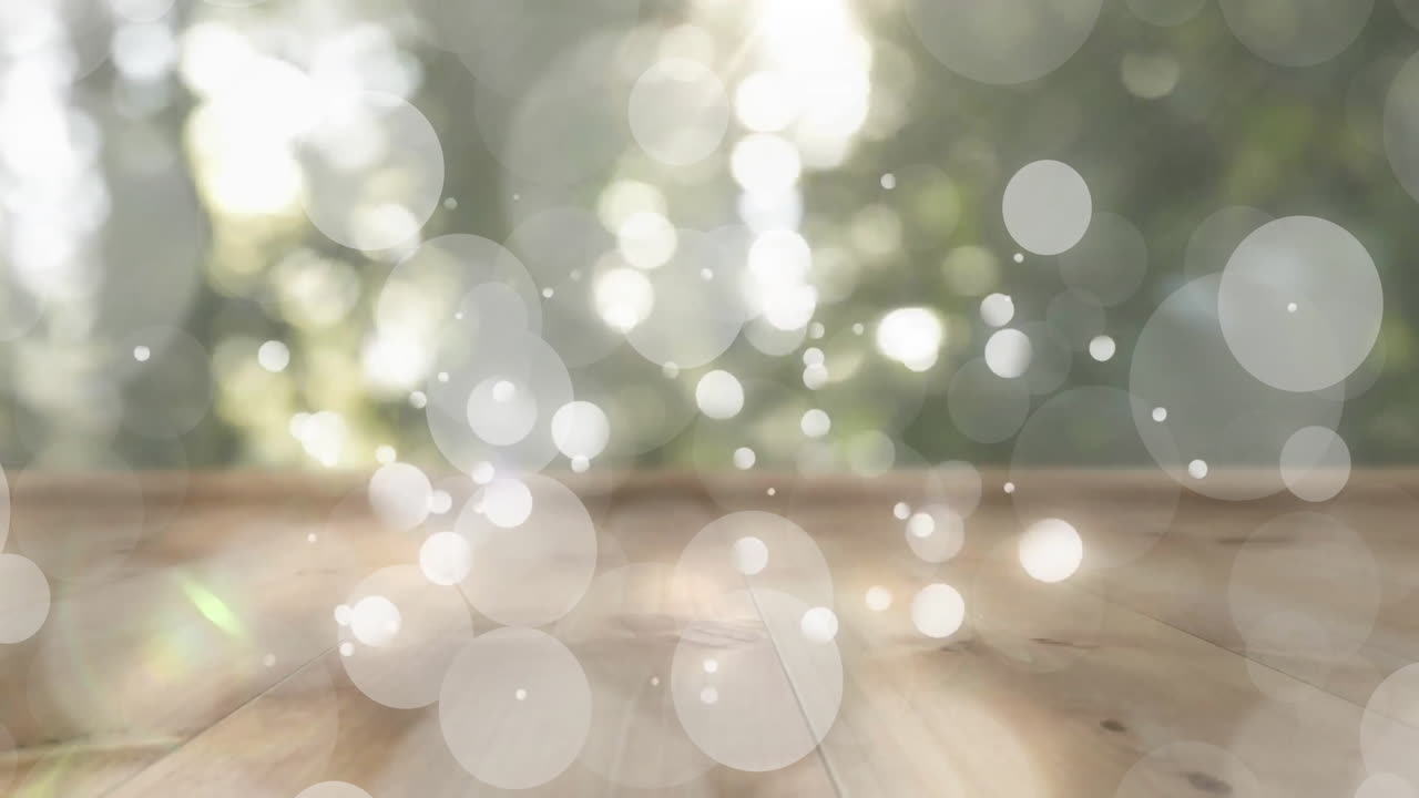 Animation of white spots and wooden table over forest