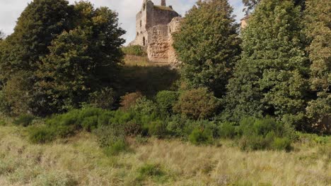 Aerial-reveal-of-an-old-historic-castle-in-Ravenscraig-Scotland