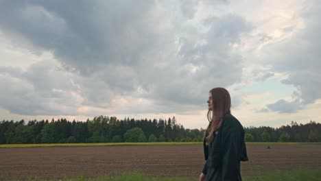 young brunette travelling alone, countryside background environment