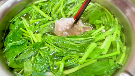 vegetables and meat cooking in hot pot