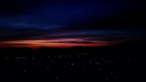 red sunset over small town called robertson with mountains in background in south africa -- dji mavic pro drone pan shot