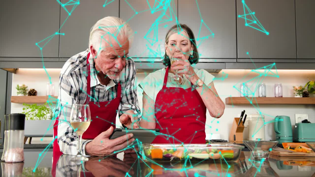 Senior duo cooking man tapping tablet showing steps while woman chopping and sipping wine, overlay