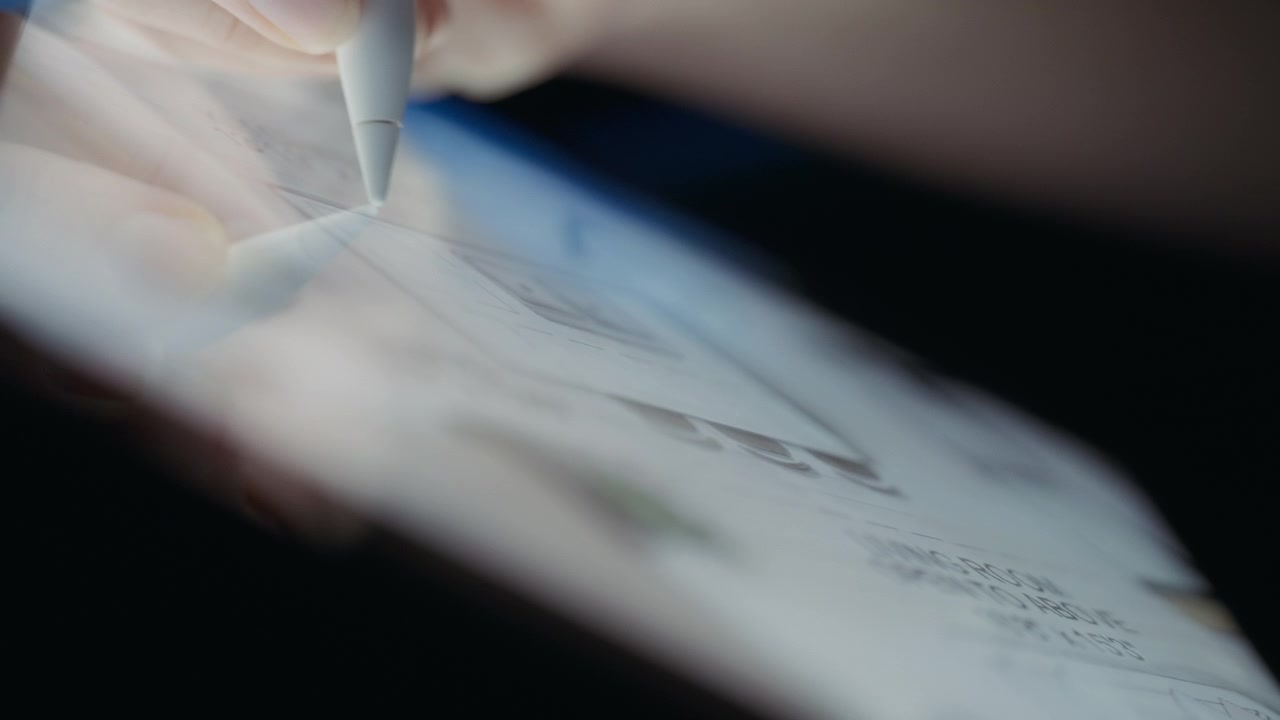 Designer drawing residential floor plan using a tablet and a pen