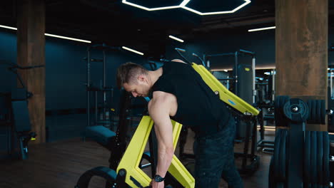 muscular man exercising in the gym. workout of people for athlete muscles inside fitness hall